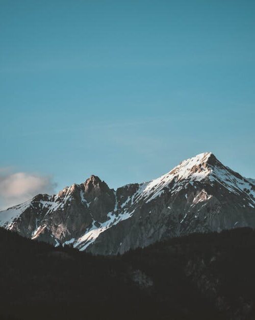Mountain Landscapes - Stunning view of snow-capped mountains against a #1054218