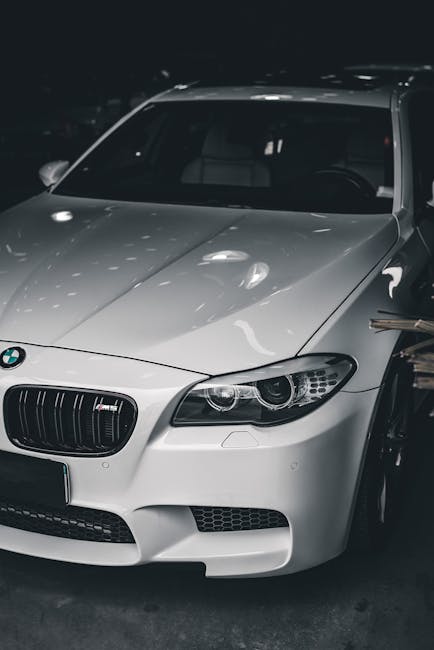 Luxury Cars - Stylish white luxury car with BMW badge under so #11291684
