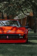 Luxury Cars - Front view of a luxurious red sports car amidst #12522907