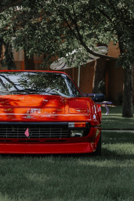 Luxury Cars - Front view of a luxurious red sports car amidst #12522907