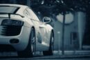 Luxury Cars - A luxury white sports car parked on a street in #13148546