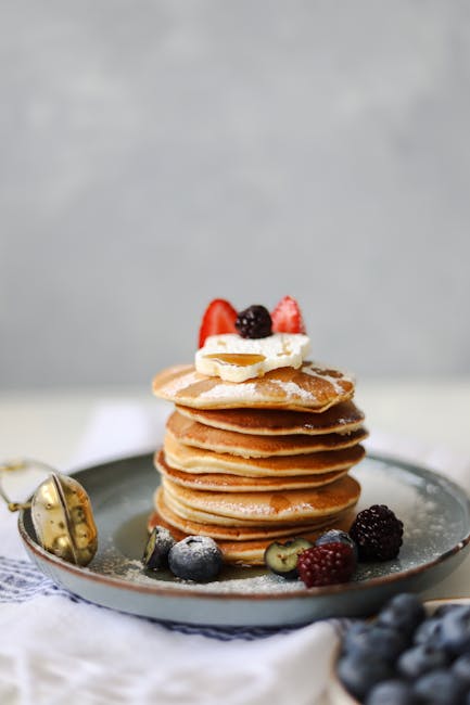 Food Aesthetics - Stack of pancakes topped with assorted fresh ber #17165552