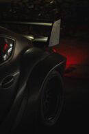 Luxury Cars - Dark, edgy shot of a sports car's rear and spoil #19209325