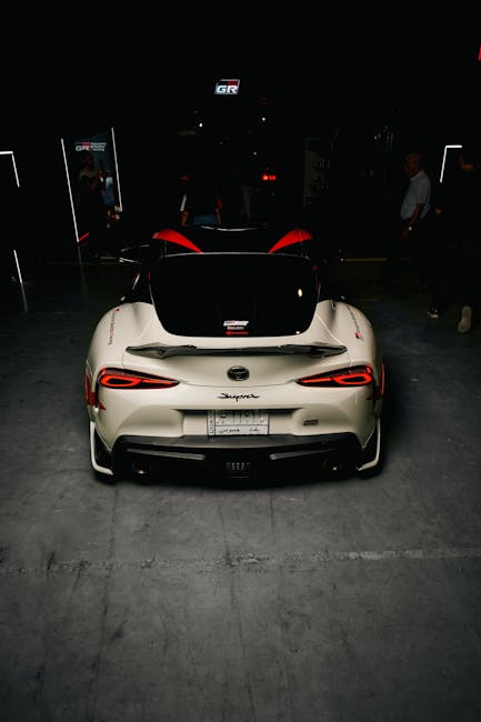 Luxury Cars - A Toyota Supra in a dimly lit showroom, highligh #28886528