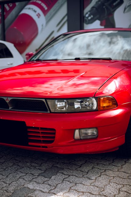 Luxury Cars - Close-up of a bright red vintage sports car park #36903246