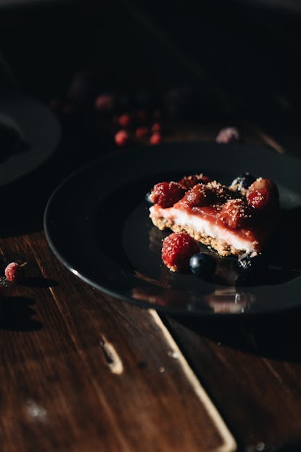 Food Aesthetics - Delicious slice of cheesecake with raspberries a #4051730