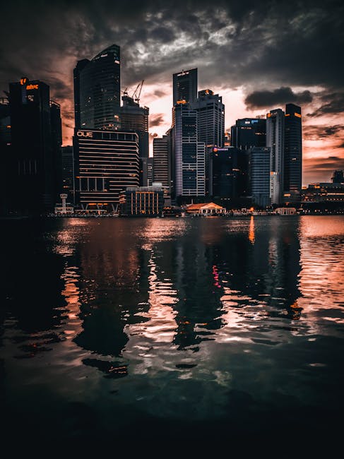 City Architecture - Dramatic view of Singapore skyline with reflecti #4829108