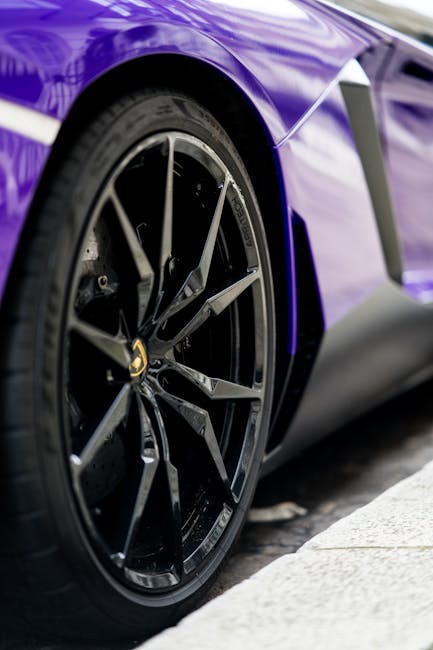 Luxury Cars - Detailed close-up of a stylish purple sports car #6152803