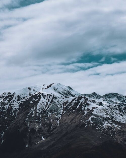 Mountain Landscapes - Majestic mountain range with snow peaks beneath #8075963