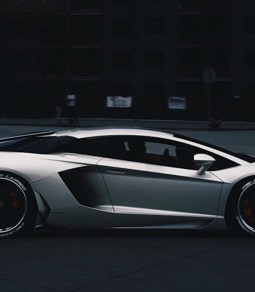 Luxury Cars - Sleek Lamborghini Aventador driving on an urban #9814982